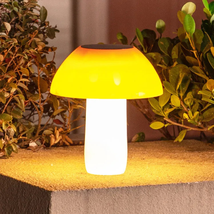 Solar-powered mushroom-shaped garden light with ground spike for lawn or border insertion.