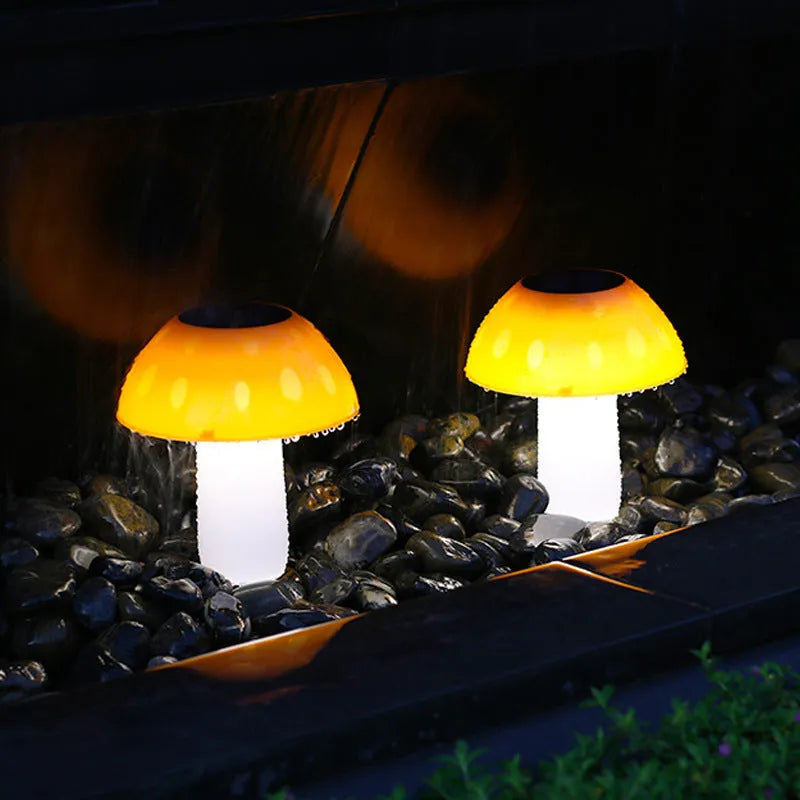 Solar-powered mushroom-shaped garden light with ground spike for lawn or border insertion.