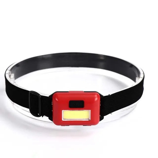 Outdoor mini COB LED headlight with polyester strap in black, blue, or red, showing compact size and lighting modes