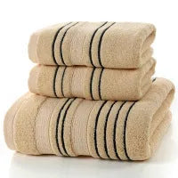 A set of one large bath towel and two smaller hand towels in a neutral colour, made from 100% cotton.