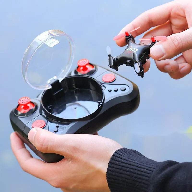 Compact remote control aircraft with fixed height function showing 360-degree roll capability and handle controller