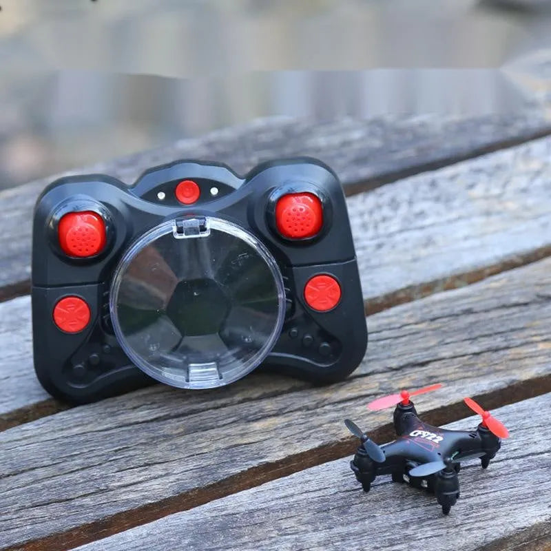 Compact remote control aircraft with fixed height function showing 360-degree roll capability and handle controller