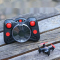 Compact remote control aircraft with fixed height function showing 360-degree roll capability and handle controller