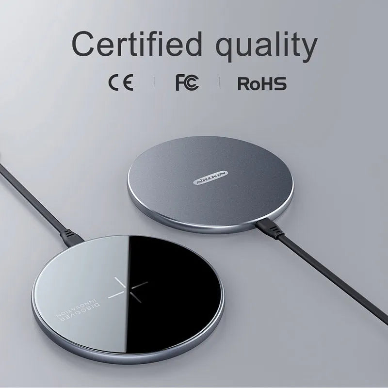 Black MagSlim NKT06 magnetic wireless charger for mobile phones on a flat surface.