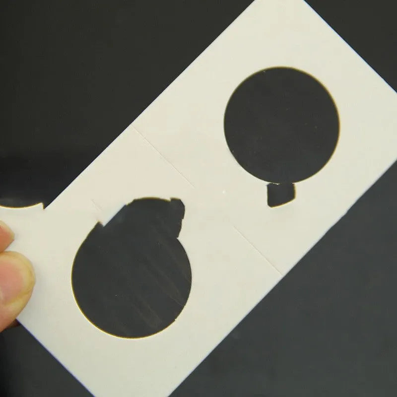 Set of 50 white paper coin protectors in a clear plastic OPP bag for commemorative coin collection.