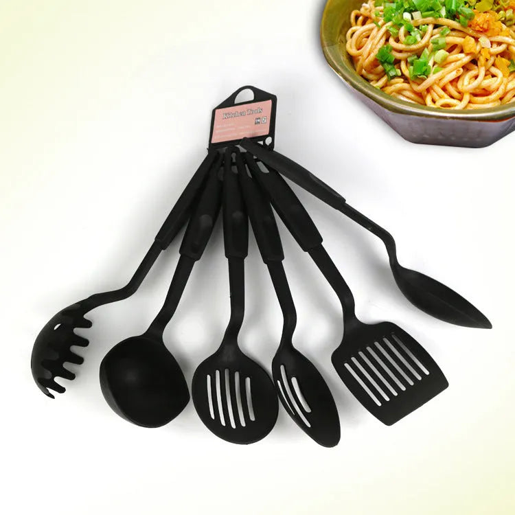 Ke Yang black rubber kitchen utensil set with spoons and shovels for non-stick pans.