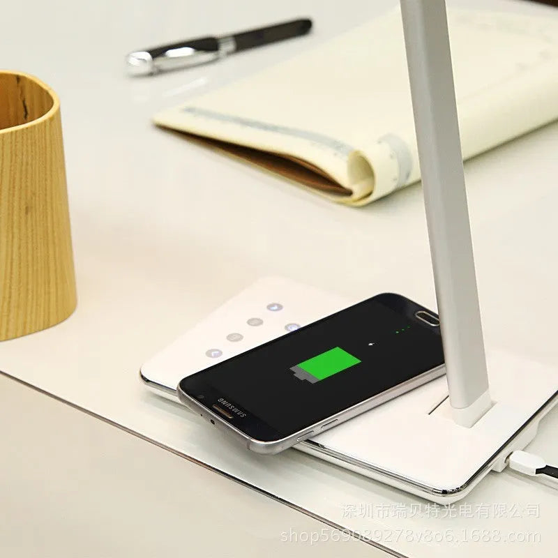 Black or white wireless charging desk lamp with touch control and USB power cable.