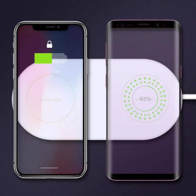 White dual wireless charger charging two mobile phones on a minimalist pad