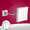 Stainless steel wall-mounted folding bathroom mirror with built-in lamp in a choice of four metallic finishes.