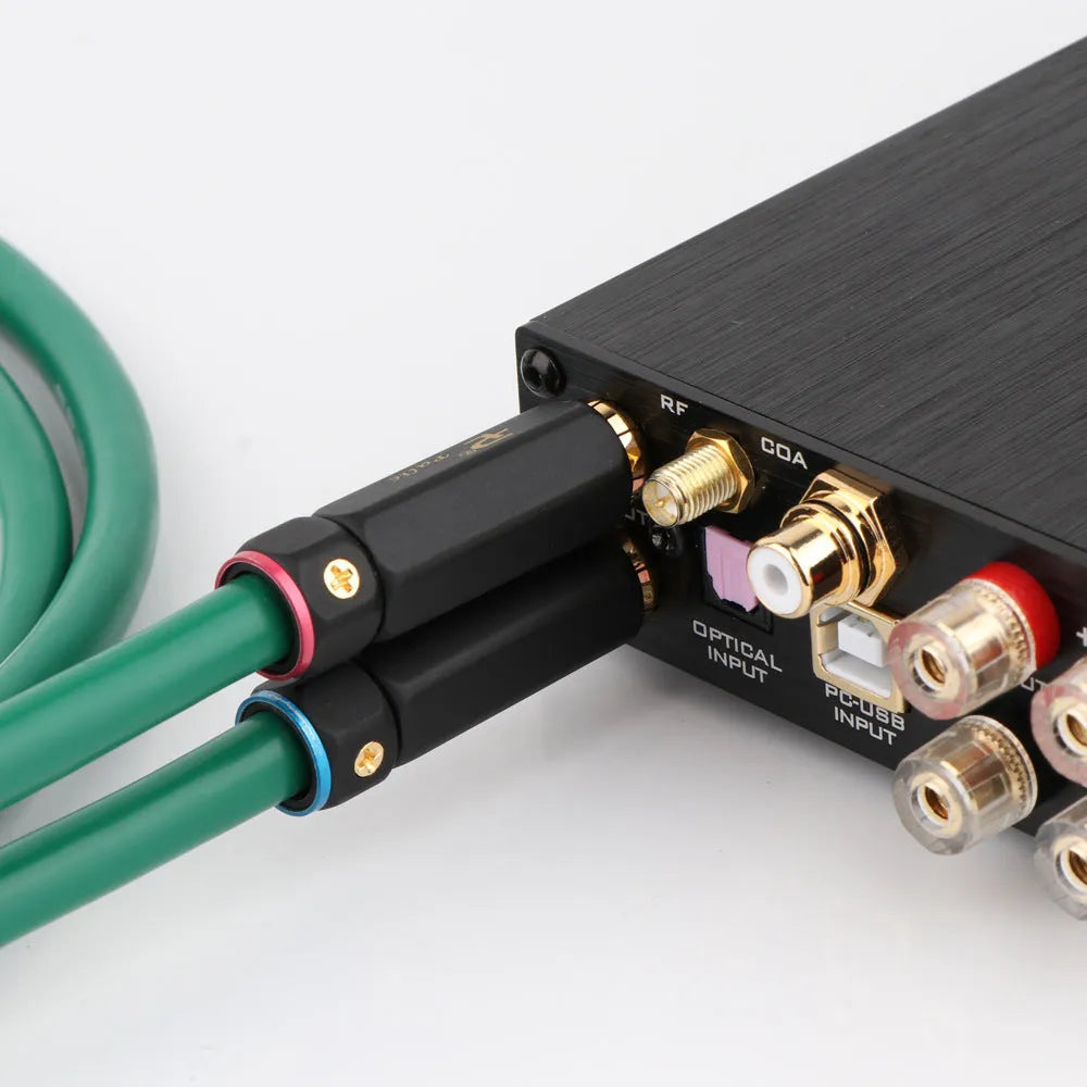 Silver-plated 4-core shielded audio interconnect cable with Lotus RCA plugs on a black background.