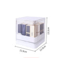 White press-lift lipstick storage box with dust cover open, showing 12 slots on a desktop.