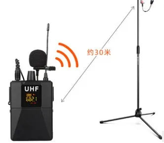 Black Little Bee Lavalier Wireless Microphone X3 clipped onto a shirt collar with USB cable