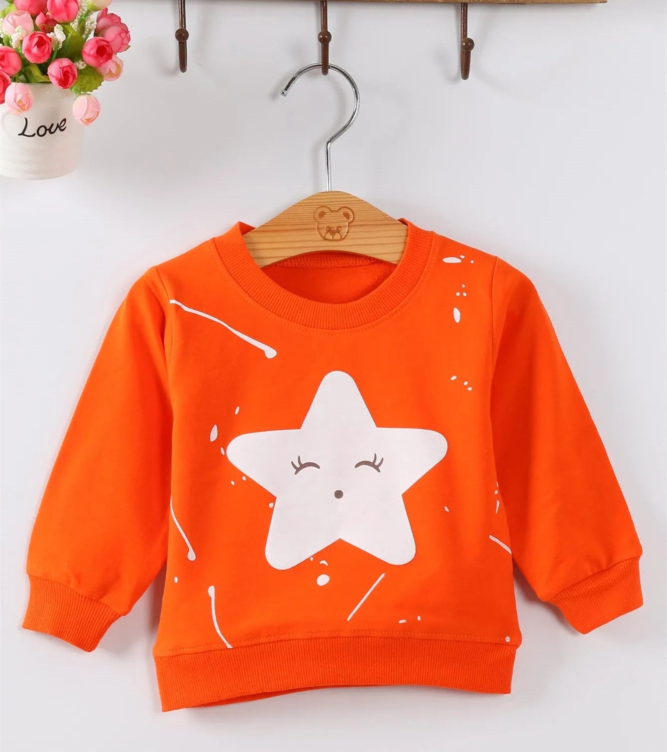 Korean style baby girl's cartoon pattern autumn sweater in soft fabric.