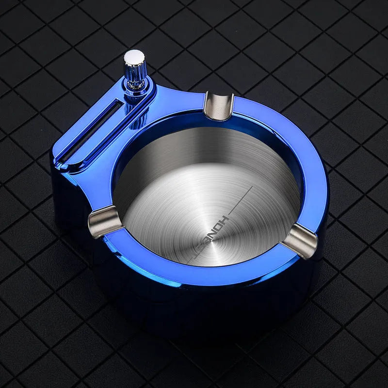 Large metal ashtray with sliding permanent match lighter and three fixed cigarette slots in blue colour