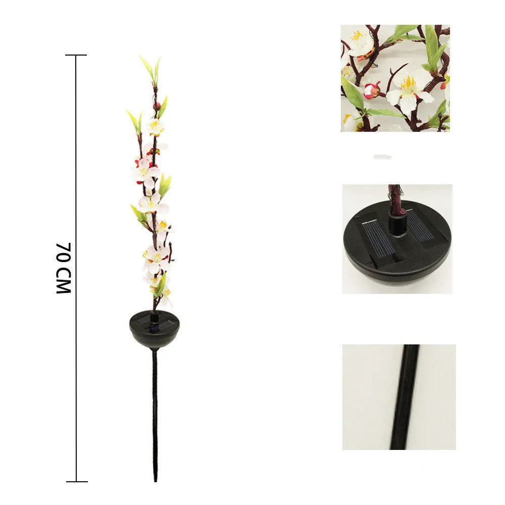 Solar-powered cherry blossom string lights with ground spike for outdoor garden decoration.