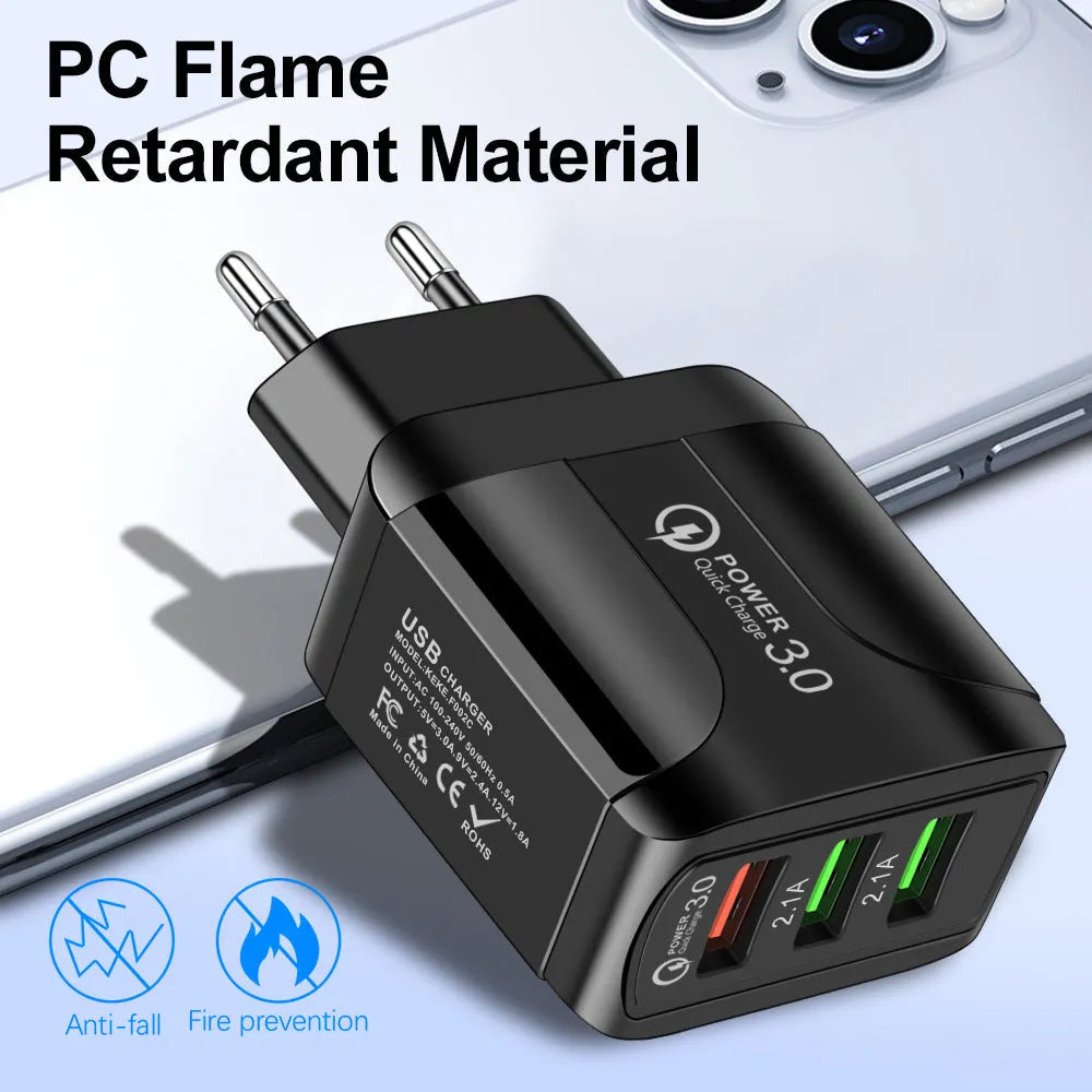 Black fast charge travel charger with 3 USB ports and a UK three-pin plug