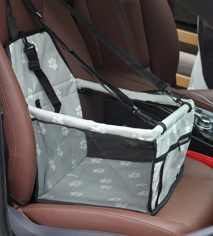 Black breathable pet car bag with anti-collapse frame and safety tether on a car seat
