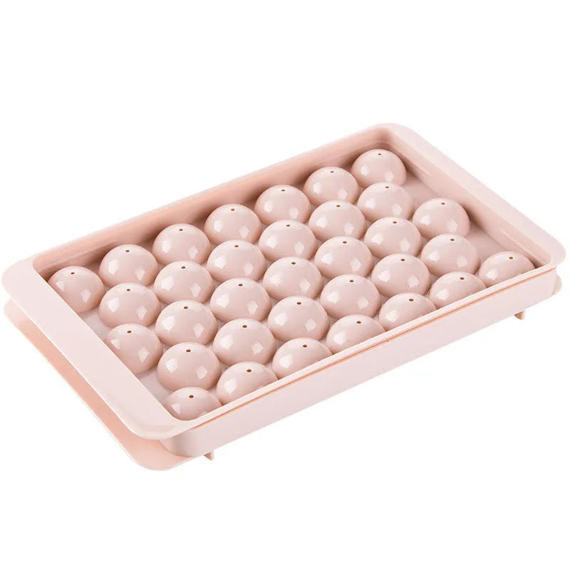 Sky blue and pink 3D round ice ball mould trays with 18 and 33 grid options for home bar use.