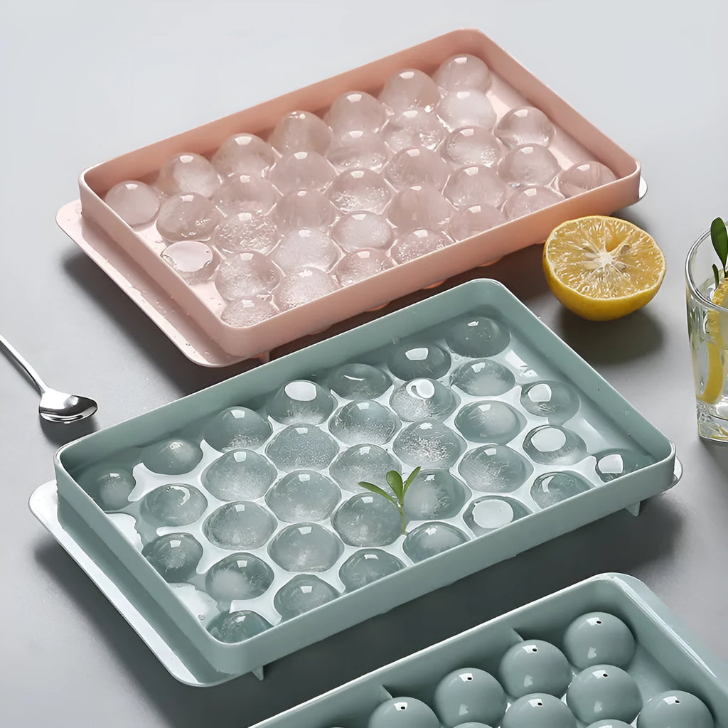 Sky blue and pink 3D round ice ball mould trays with 18 and 33 grid options for home bar use.
