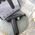 God Fascia Gun handheld percussion muscle massager in grey colour with USB charging port visible