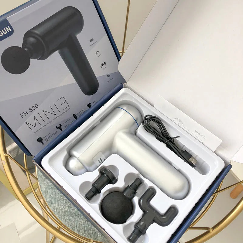 God Fascia Gun handheld percussion muscle massager in grey colour with USB charging port visible