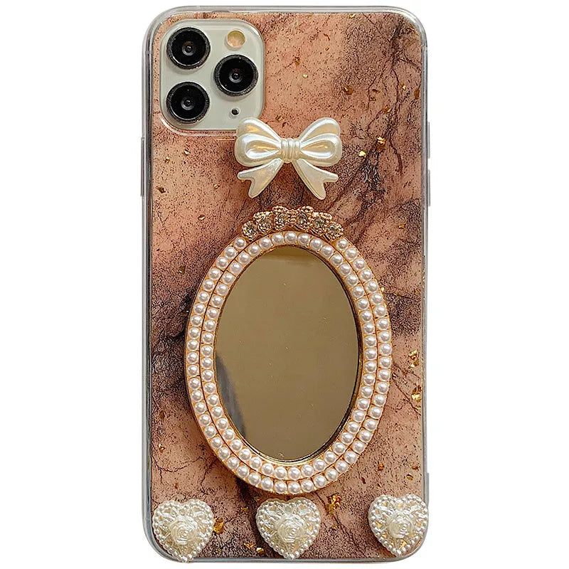 Brown marble pattern bowknot rhinestone decorative case for iPhone with a mirror back.