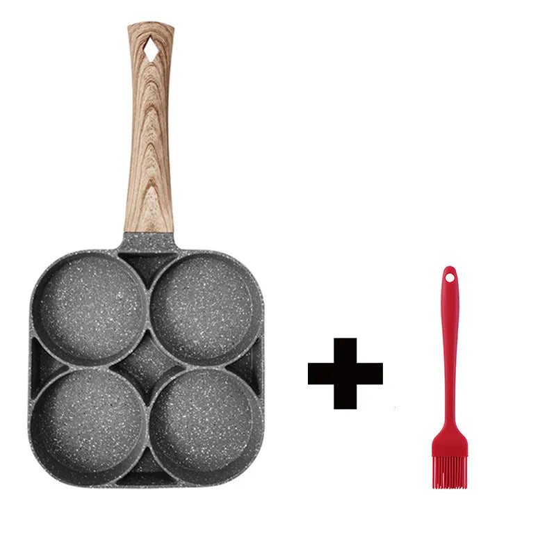 Aluminium four-hole non-stick frying pan with optional silicone spatula and brush on a hob