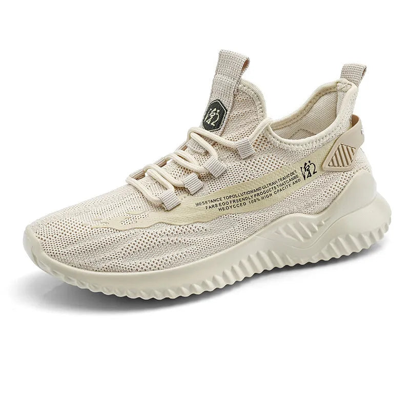 Men's white mesh sports shoes with rubber sole and round toe design on neutral background
