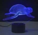 Colourful 3D visual effect LED table lamp with touch controls on a black ABS base