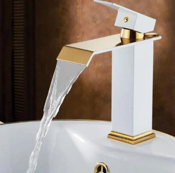 Black basin faucet with gold accents and waterfall spout in touchless induction design