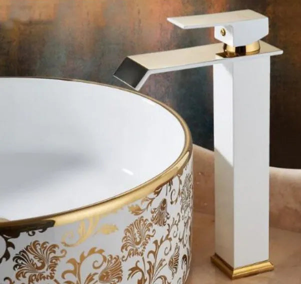 Black basin faucet with gold accents and waterfall spout in touchless induction design