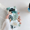 Slim green leaf floral TPU back cover case for Samsung Galaxy phone on a white background.