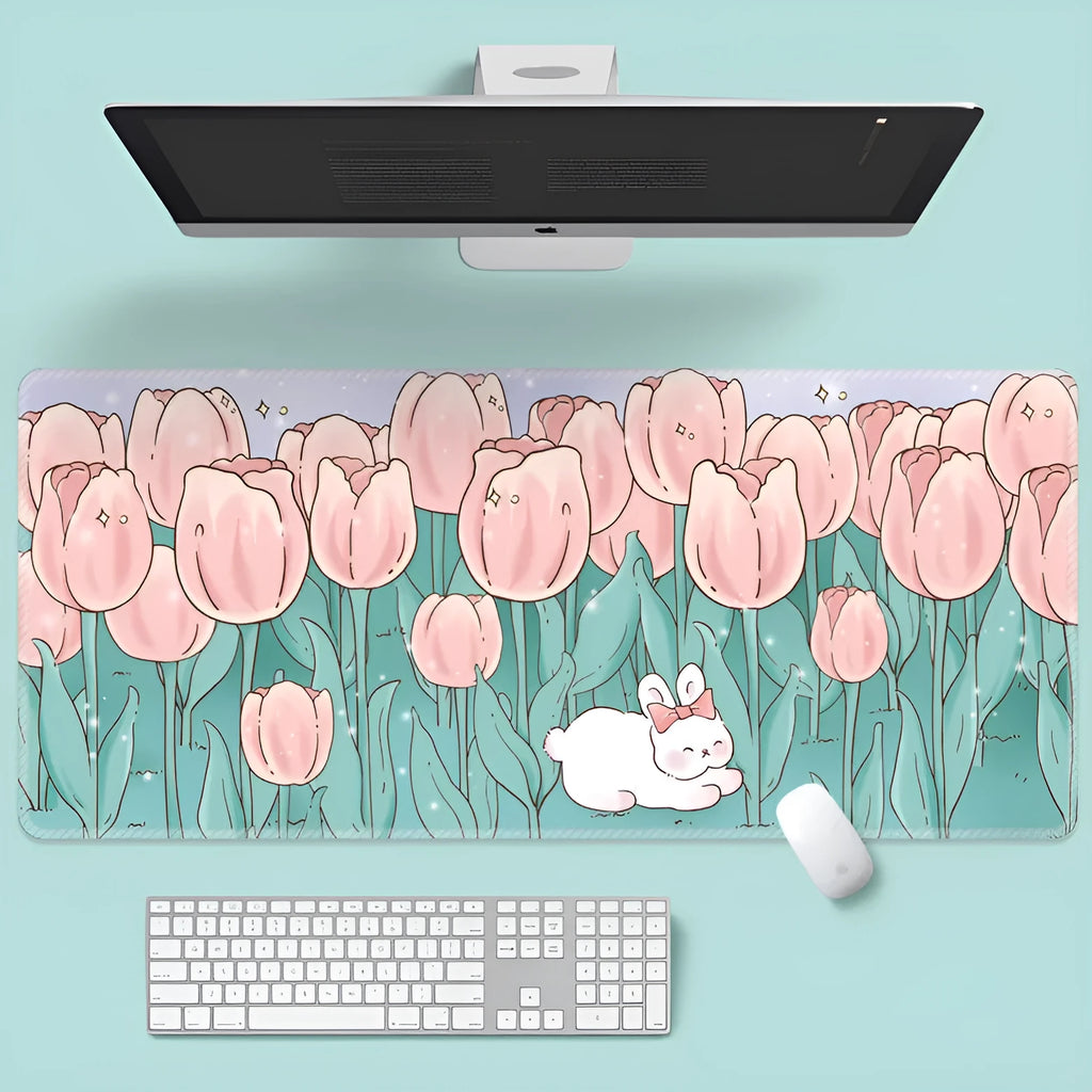 Large rectangular flower pattern mouse pad on a desk with keyboard and mouse.