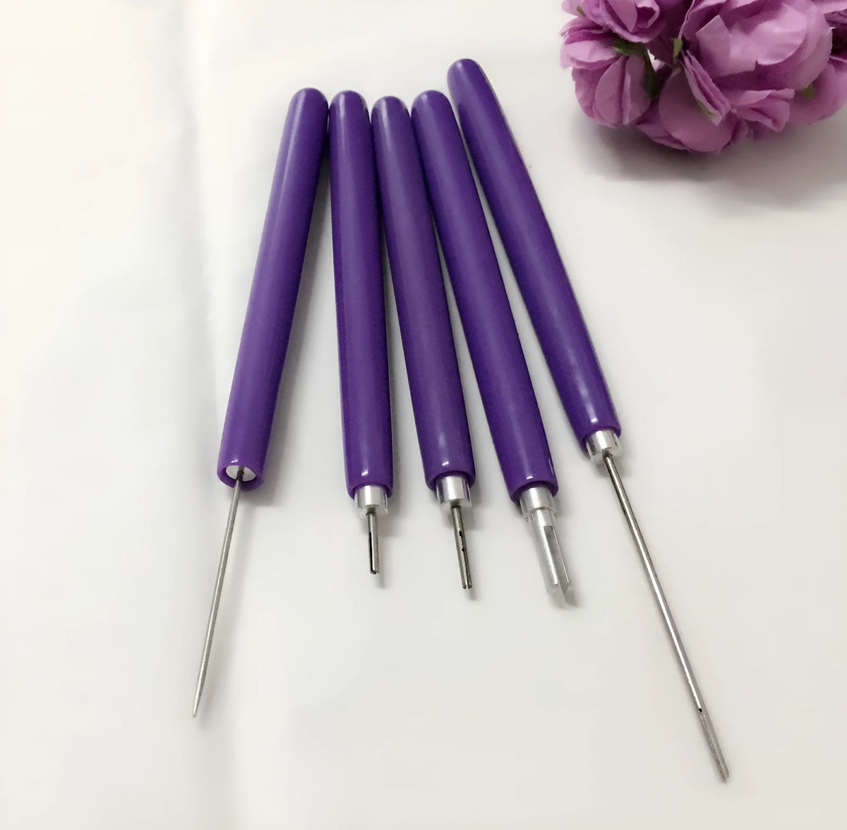 Purple five-piece quilling paper pen set with 0.3mm and 1.3mm slotted pens and a 1.1mm needle stylus.
