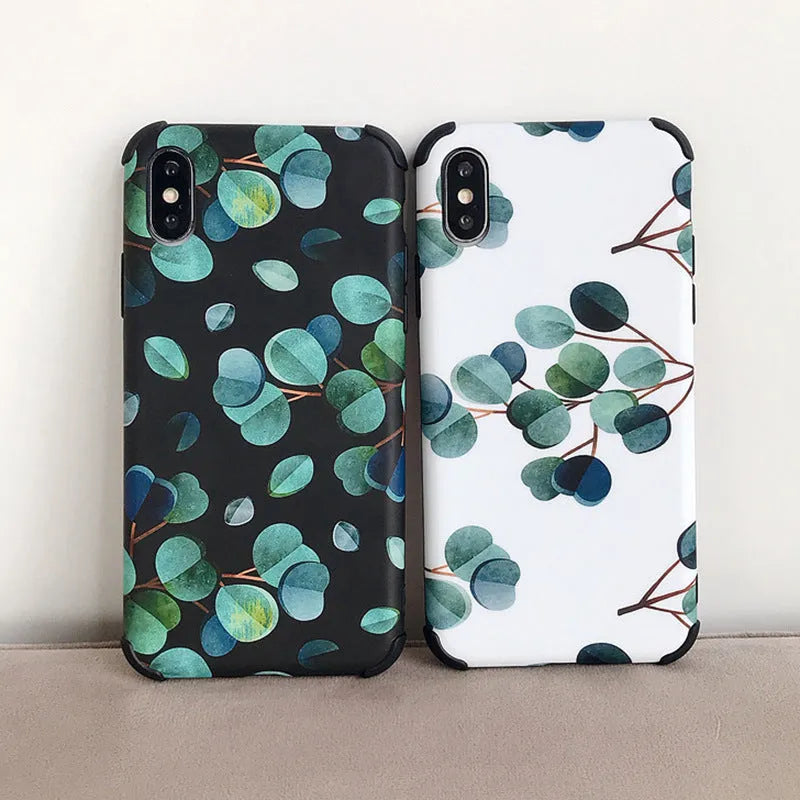 Black silicone iPhone case with a green leaf and botanical floral print design.