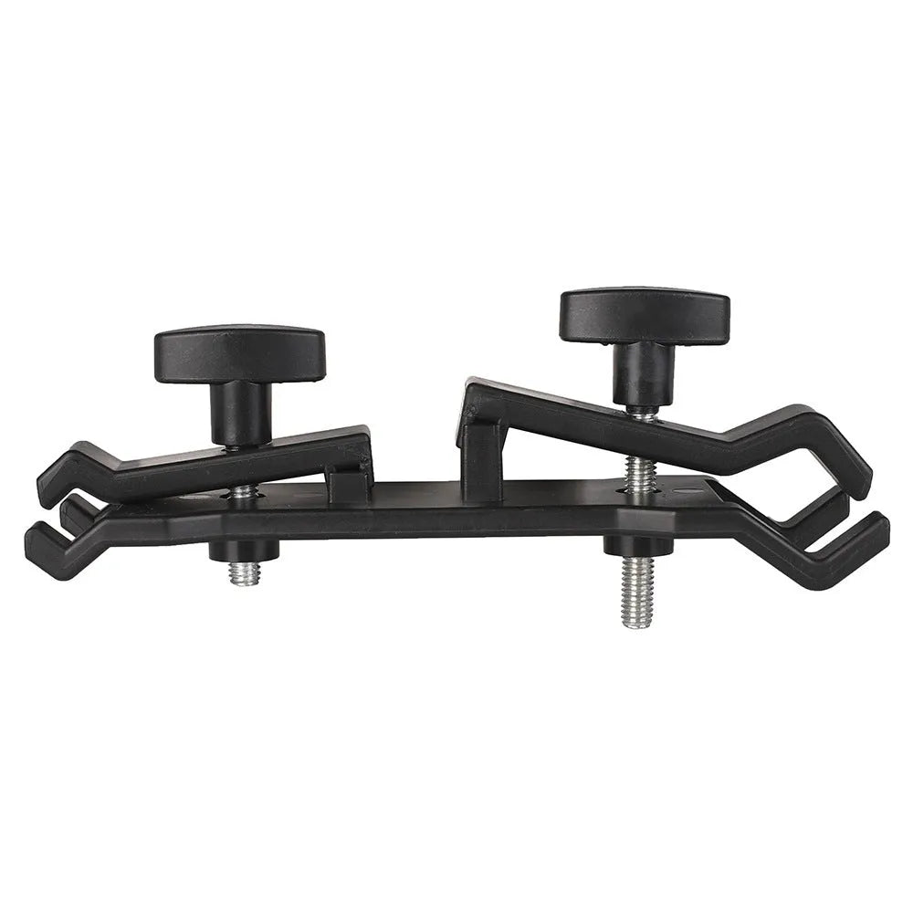 Black camera umbrella clip attached to tripod with umbrella for filming protection