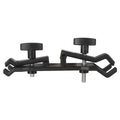 Black camera umbrella clip attached to tripod with umbrella for filming protection