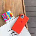 Simple solid-colour silicone phone case for iPhone, shown in a selection of colours including dark green and light pink.