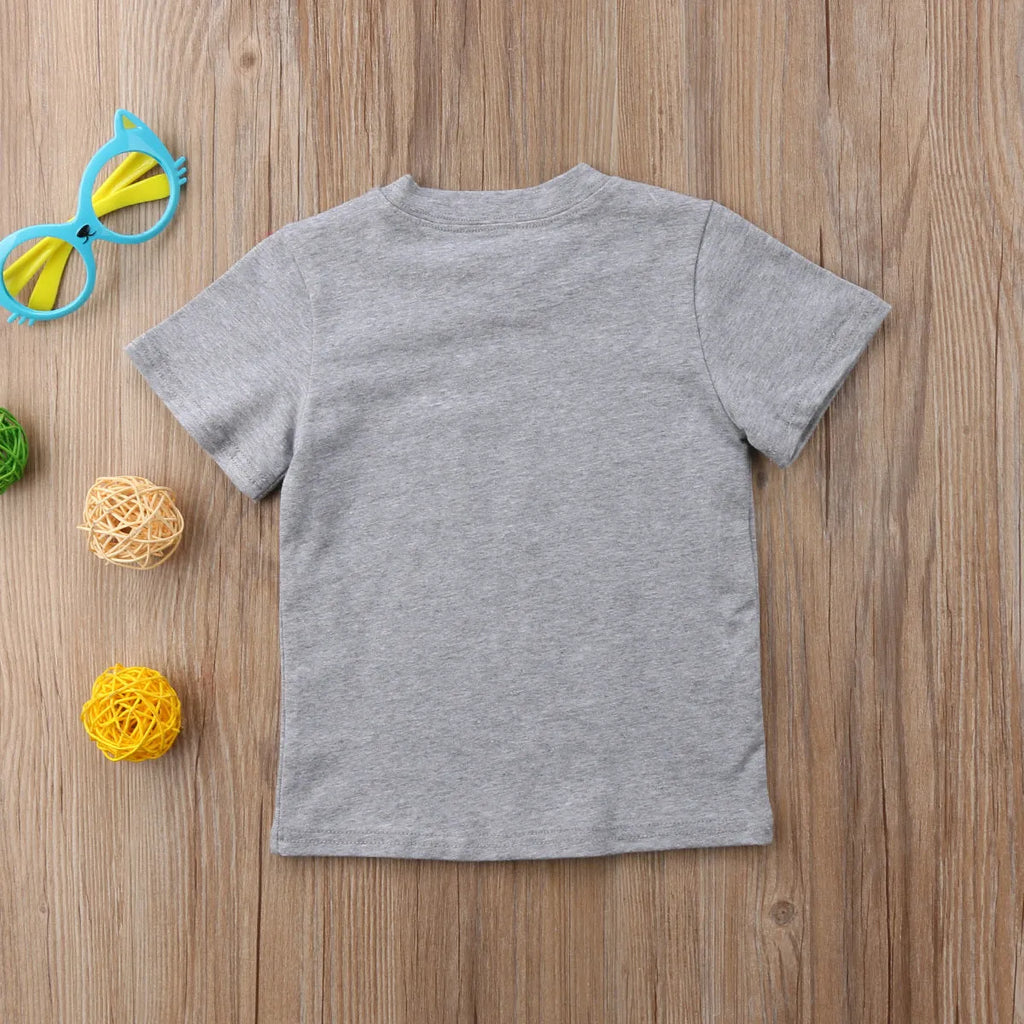 A grey printed cotton t-shirt for children showing a screen-printed graphic design on the front.