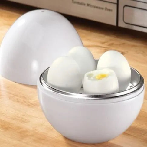 White microwave egg cooker steamer with capacity for four eggs, showing vent hole and knob.