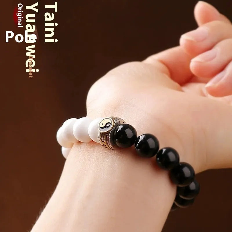 Black and white obsidian bracelet with taiji symbol and geometric beads