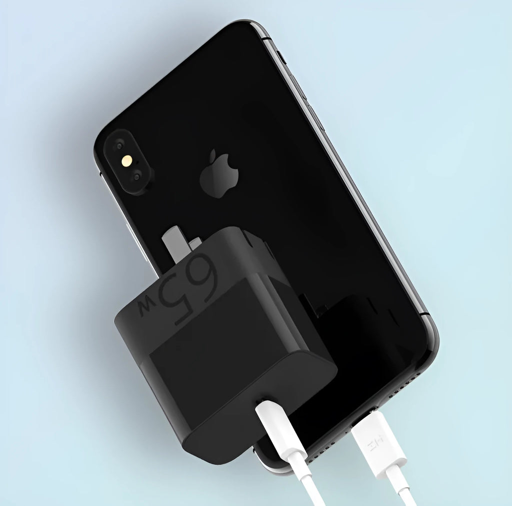 Black ZMI 65W USB-C laptop power adapter showing compact dimensions