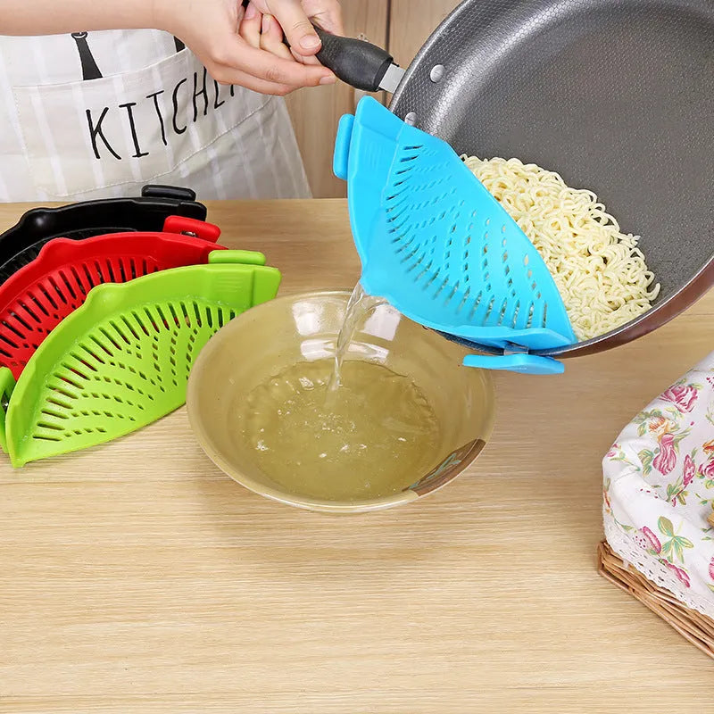 Silicone clip-on kitchen strainer with stainless steel mesh attached to pot rim for draining liquids