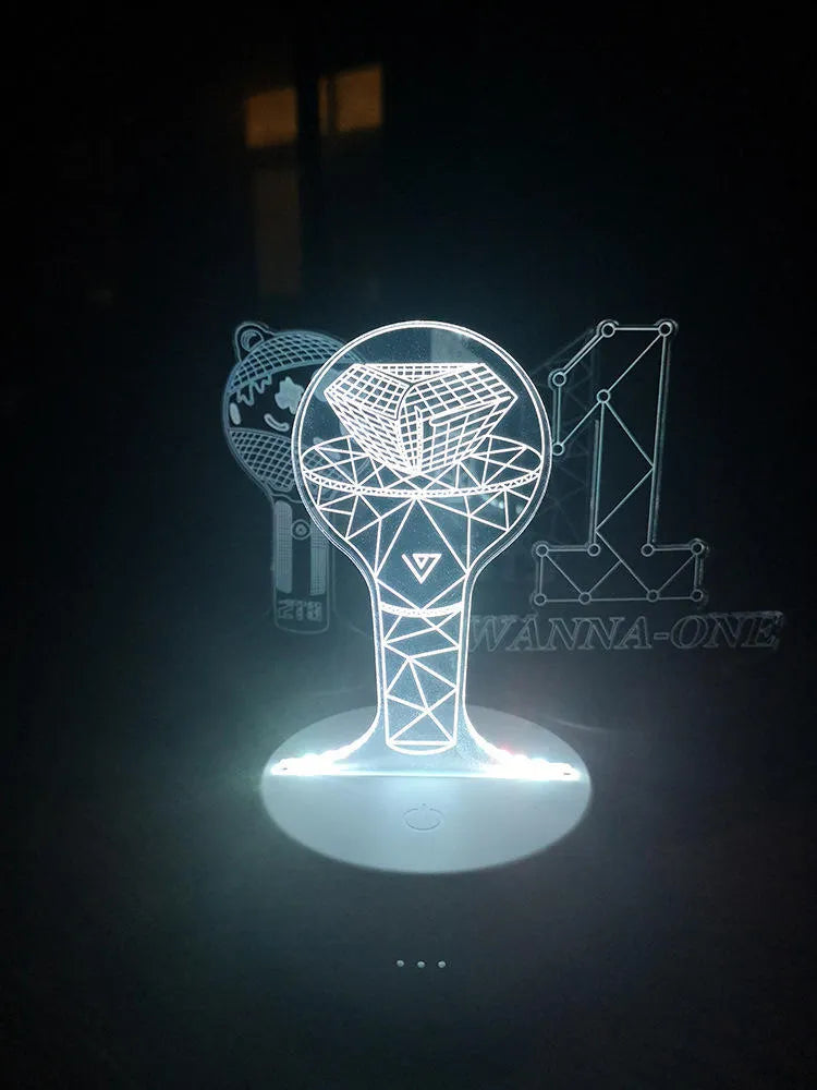 BTS-themed acrylic light-up display stand holding BTS Light 101 Tower Gem collectible