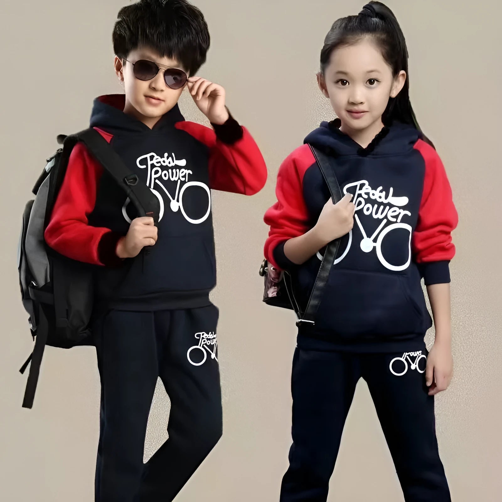 Older child wearing a black Korean-style printed sports suit two-piece set.