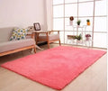 Plush solid-colour velvet lambskin carpet with non-slip dotted bottom, shown in a range of colours.