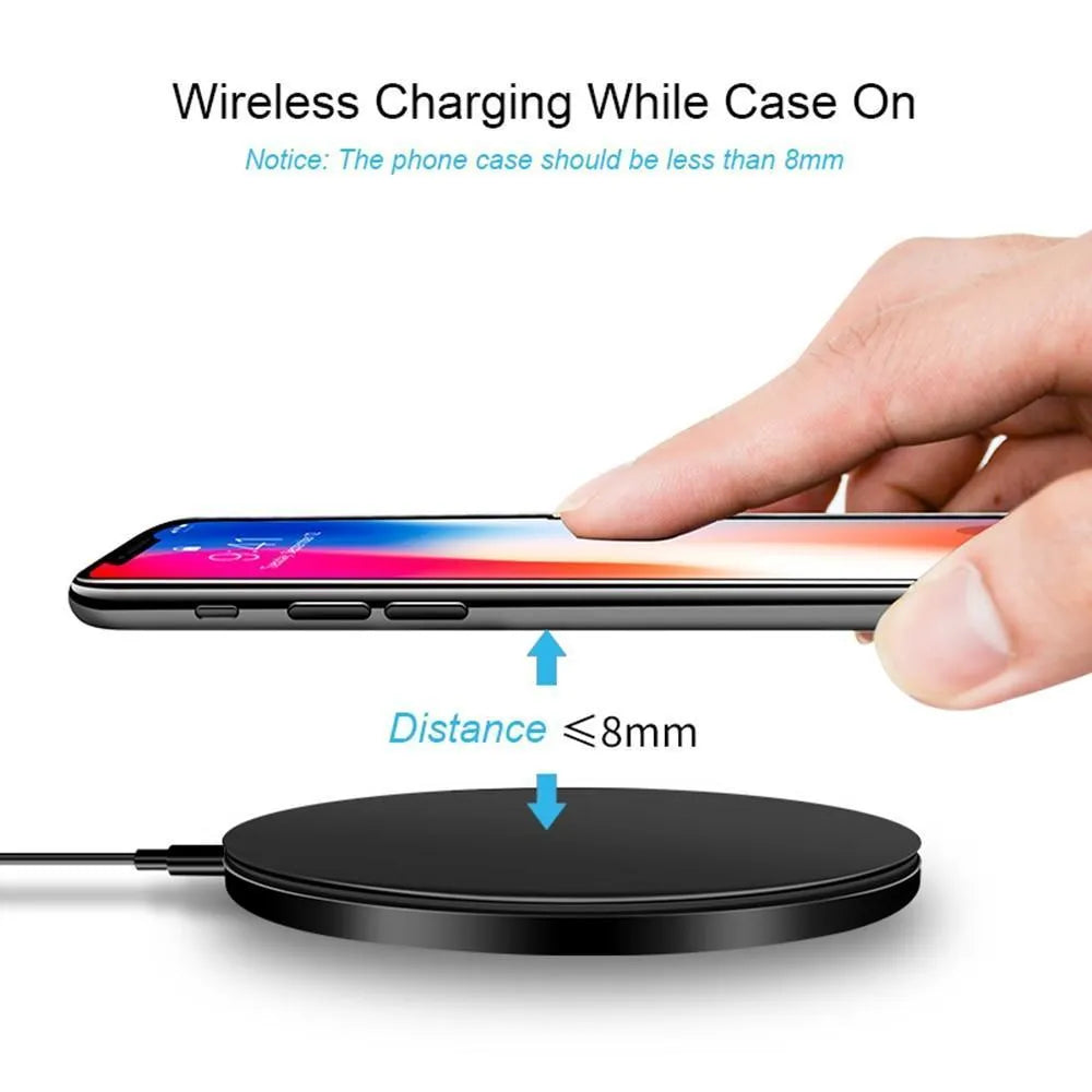 Ultra-thin black wireless charging pad measuring 98mm square with 6.5mm thickness on desk surface