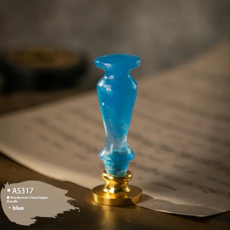 Wooden wax seal handle in various colours like ancient gold, dark green, and purple for sealing wax applications