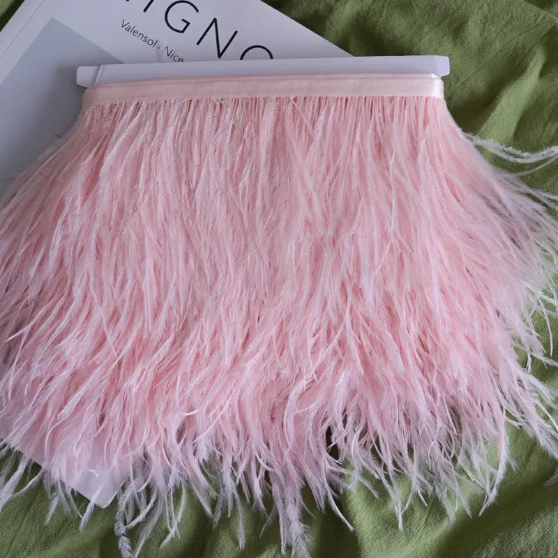 Decorative feather texture cloth strip in various colours, showing its width and texture for DIY crafts.