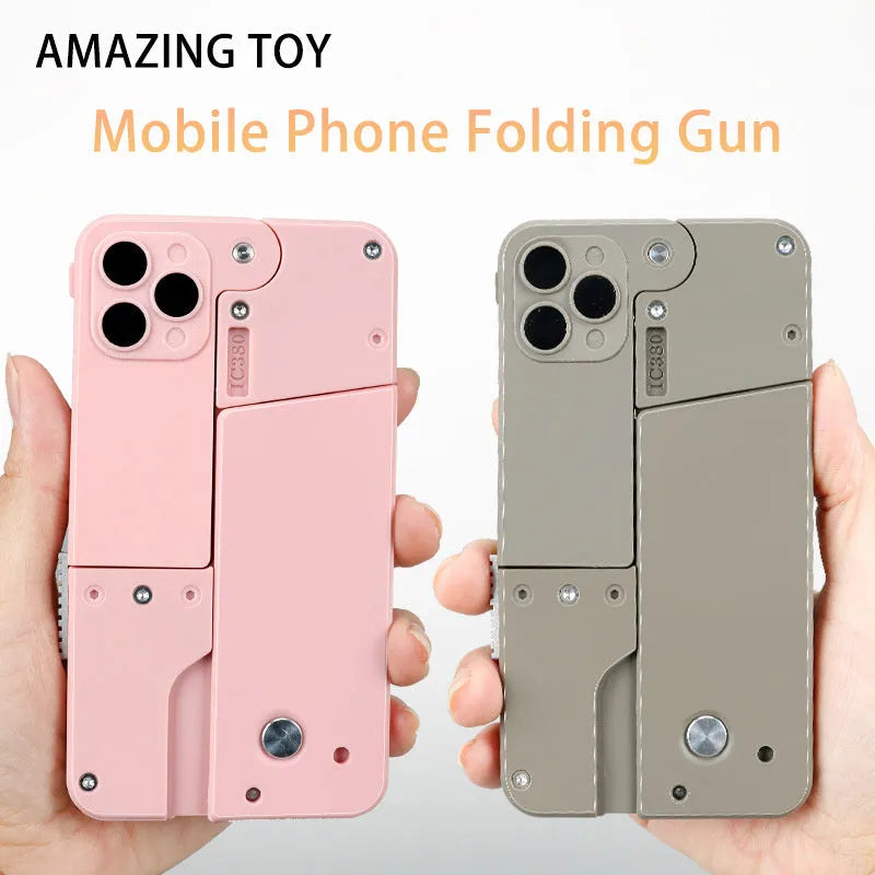 Folding mobile phone toy dart blaster in pink showing double barrels and safe EVA foam bullets